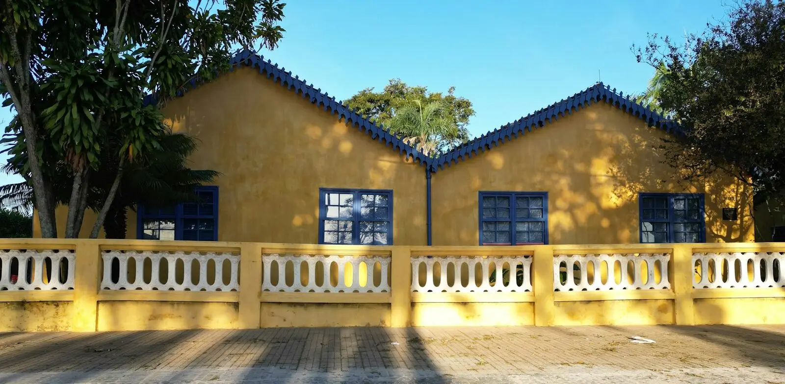 the shadow of a person standing in front of a house